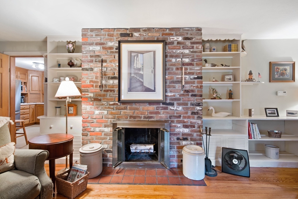 197 Hazardville Road Longmeadow, MA 01106 - Photo 13 of 37 a living room with furniture a fireplace and a large mirror