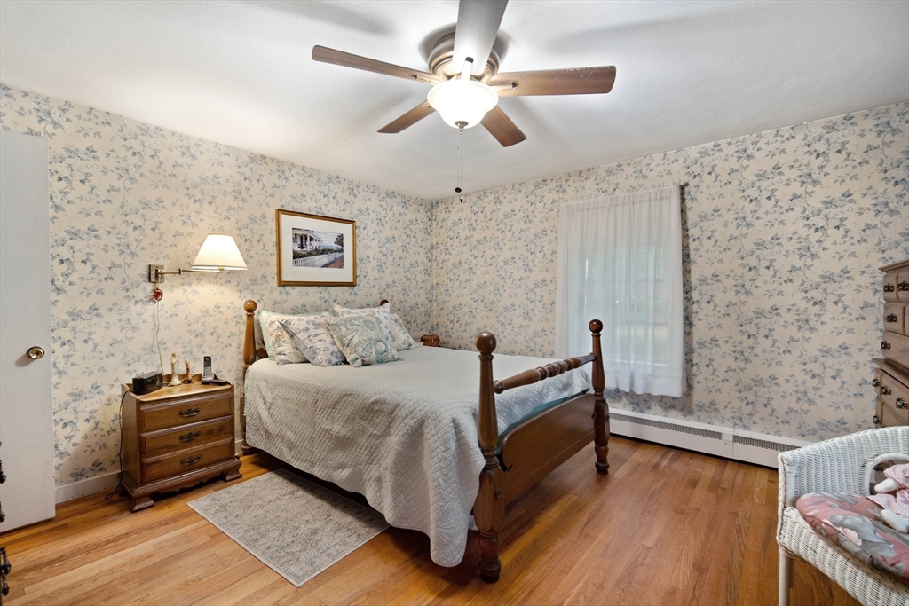 197 Hazardville Road Longmeadow, MA 01106 - Photo 15 of 37 a bed room with a bed and a couch