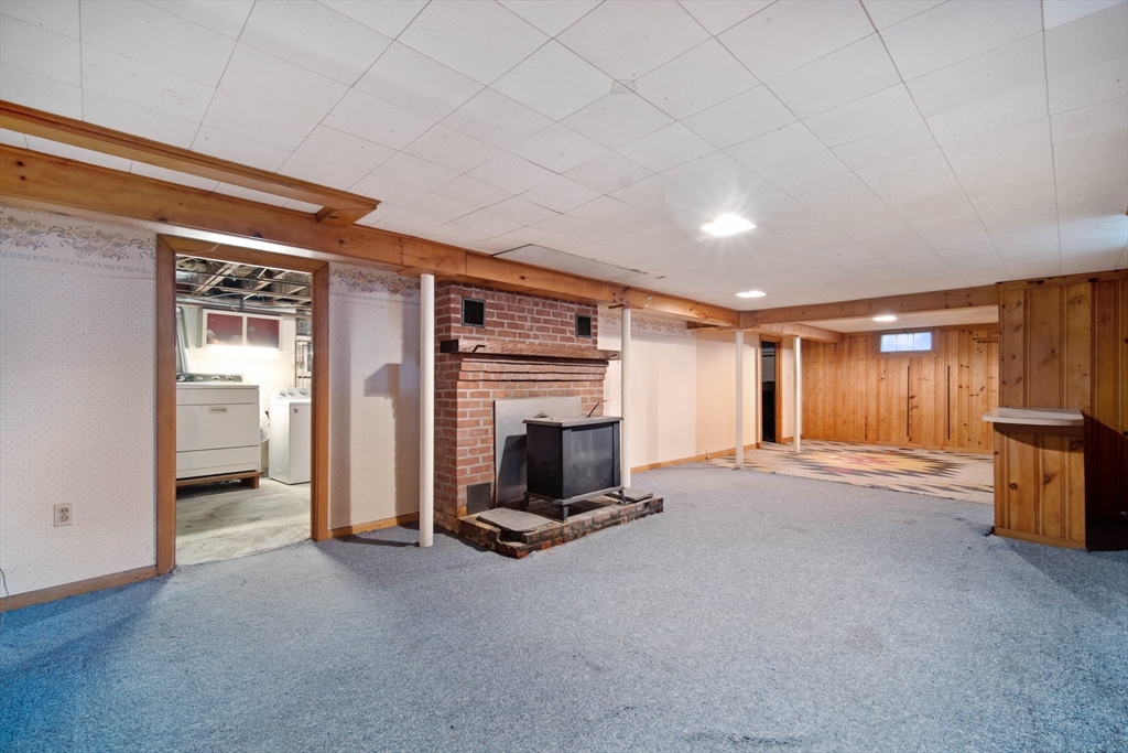197 Hazardville Road Longmeadow, MA 01106 - Photo 29 of 37 a view of a livingroom with fireplace and kitchen
