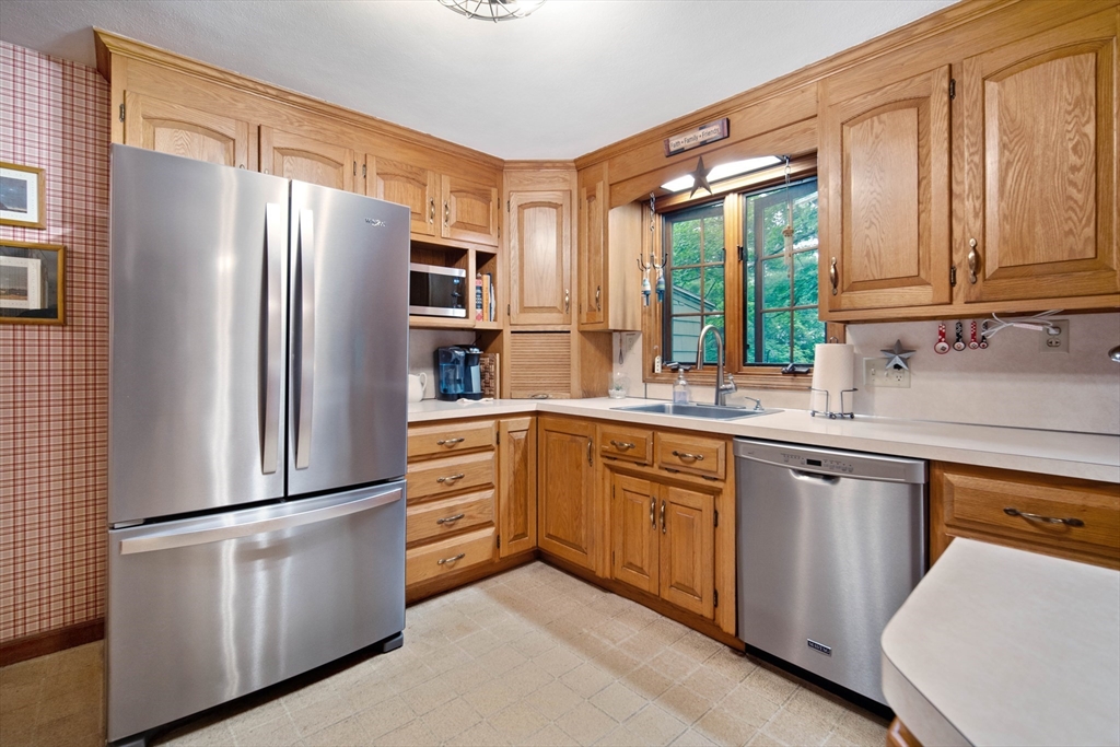 197 Hazardville Road Longmeadow, MA 01106 - Photo 5 of 37 a kitchen with stainless steel appliances a refrigerator sink and cabinets