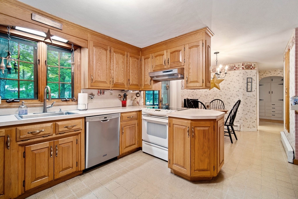 197 Hazardville Road Longmeadow, MA 01106 - Photo 6 of 37 a kitchen that has a sink and a stove in it