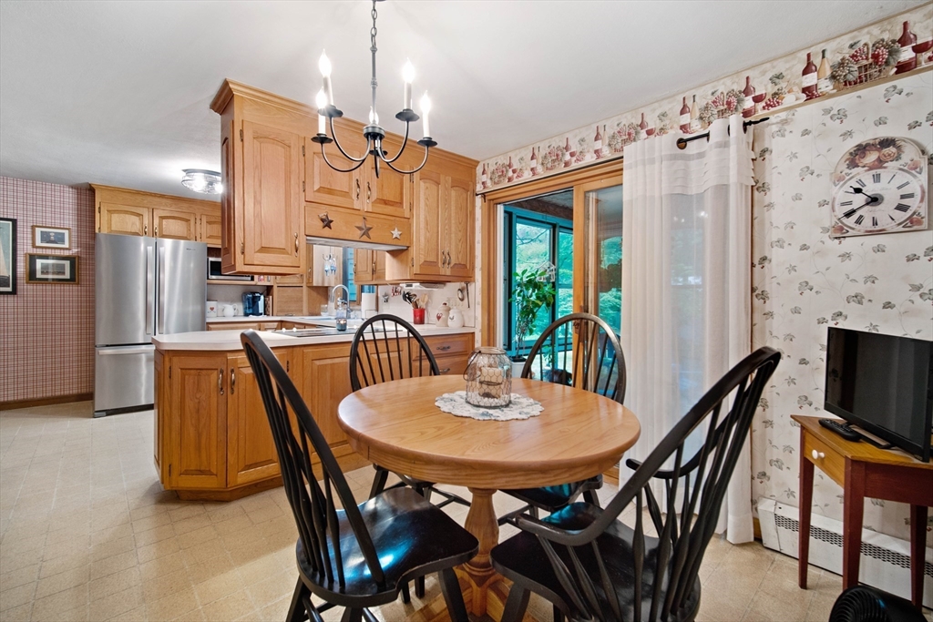 197 Hazardville Road Longmeadow, MA 01106 - Photo 9 of 37 a view of a dining room with furniture and a chandelier
