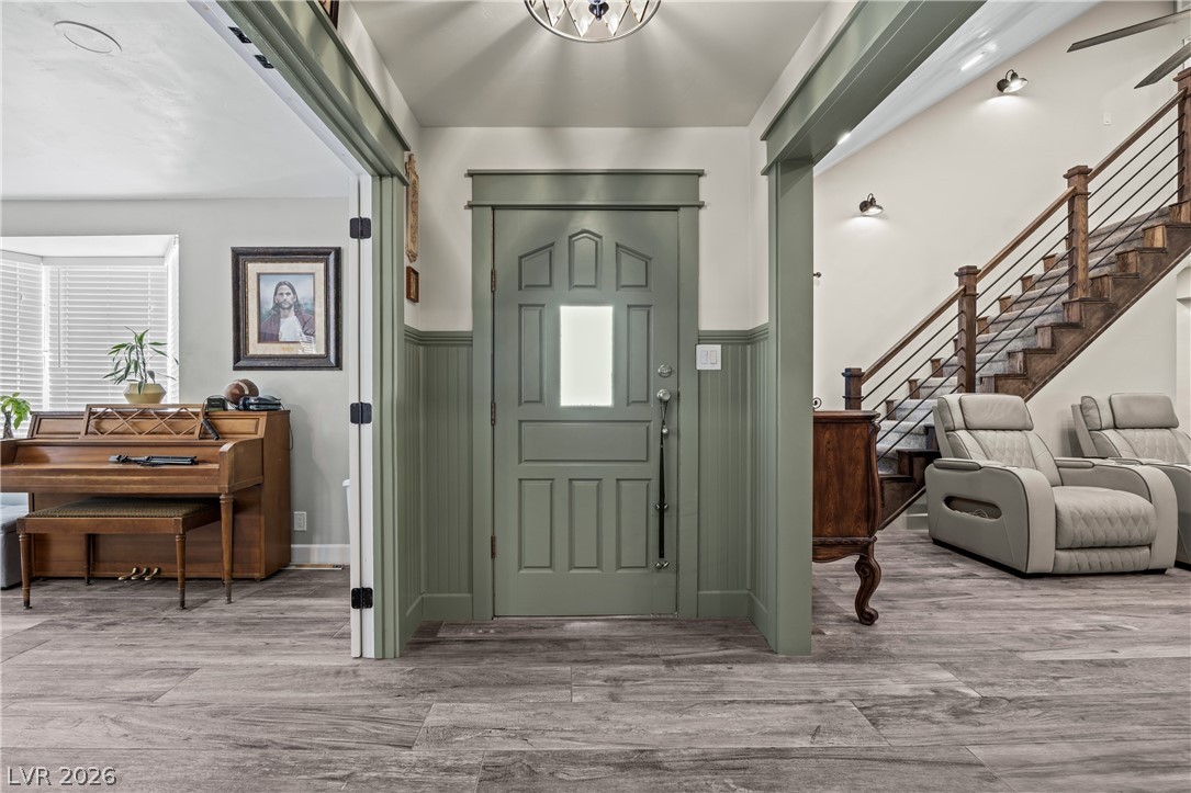 750 Leming Avenue Overton, NV 89040 - Photo 10 of 82 Step into this welcoming foyer featuring wood flooring and a striking wooden staircase.