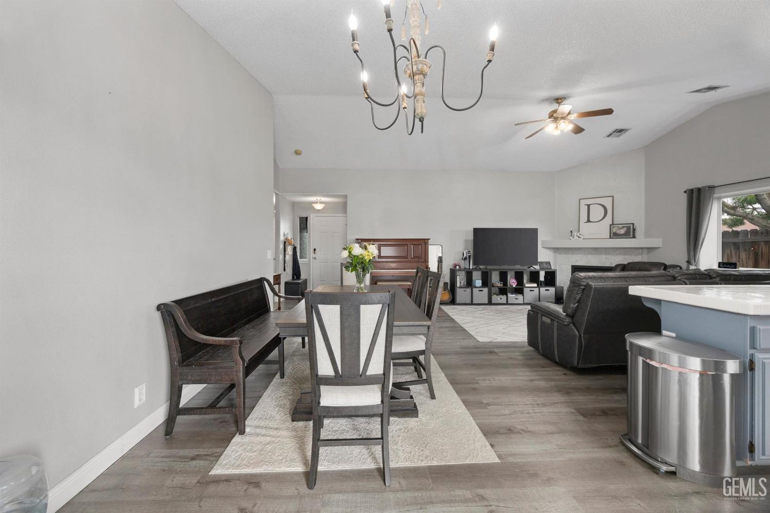 Undisclosed Address Bakersfield, CA 93312 - Photo 11 of 31 a view of a dining room with furniture and a chandelier fan