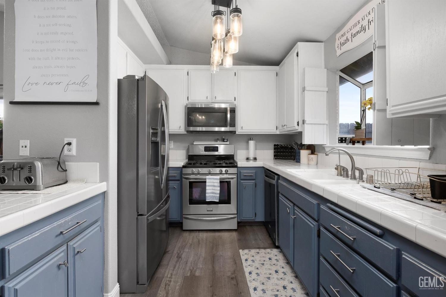 Undisclosed Address Bakersfield, CA 93312 - Photo 13 of 31 a kitchen with stainless steel appliances granite countertop a sink stove and refrigerator