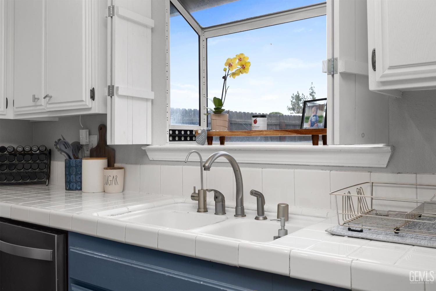 Undisclosed Address Bakersfield, CA 93312 - Photo 15 of 31 a kitchen with a sink and a window