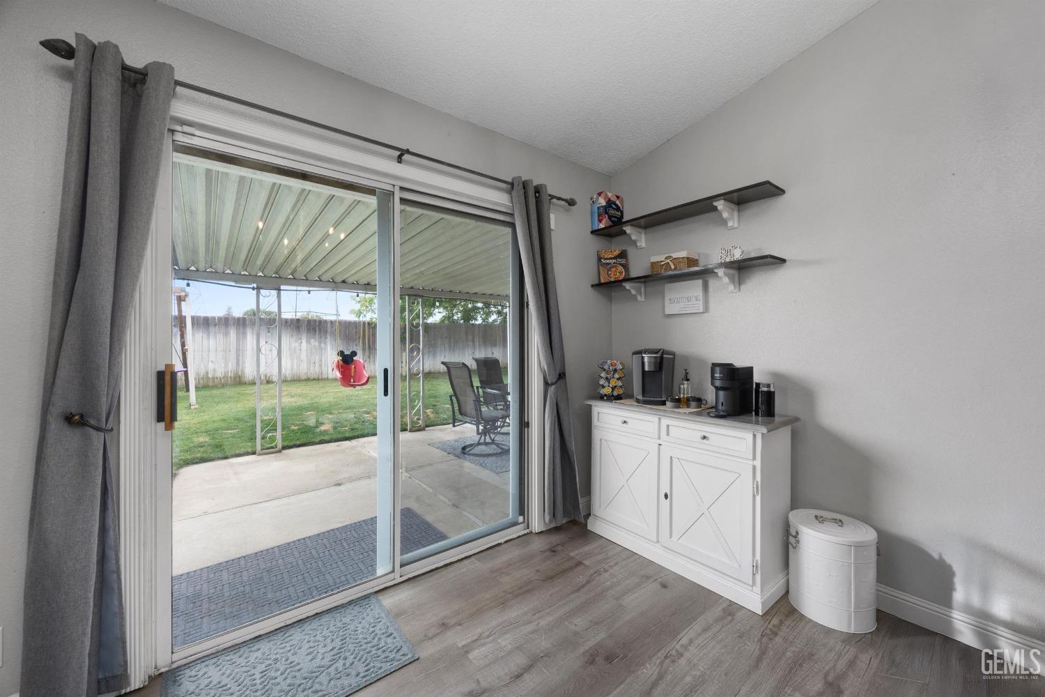 Undisclosed Address Bakersfield, CA 93312 - Photo 16 of 31 a kitchen with a sink and wooden cabinets