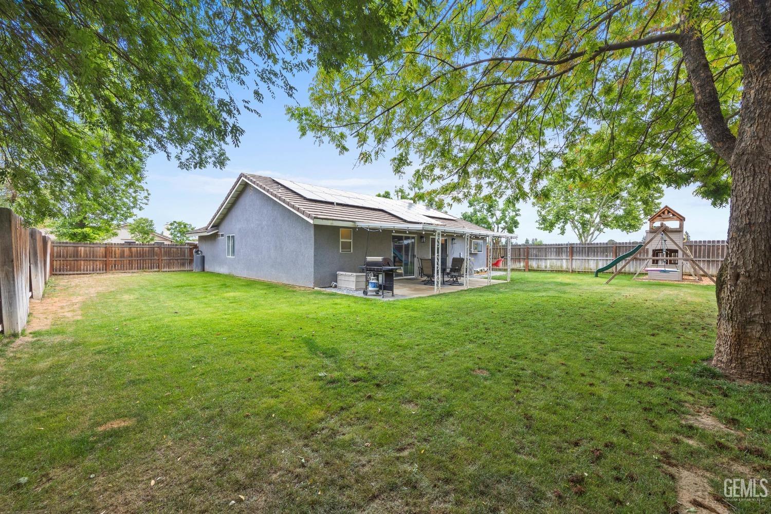 Undisclosed Address Bakersfield, CA 93312 - Photo 29 of 31 a view of a house with backyard and a tree