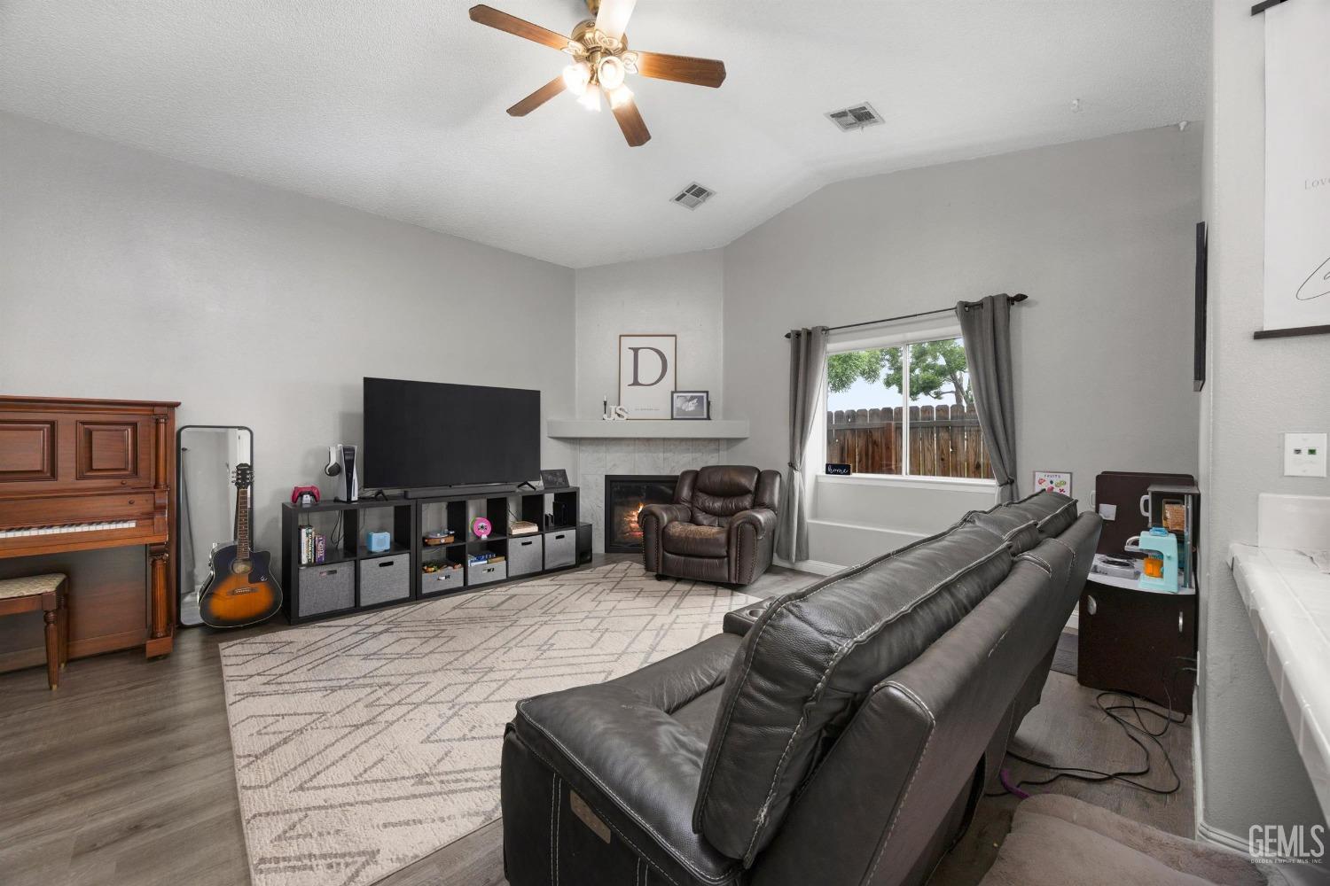 Undisclosed Address Bakersfield, CA 93312 - Photo 8 of 31 a view of a livingroom with furniture and a flat screen tv