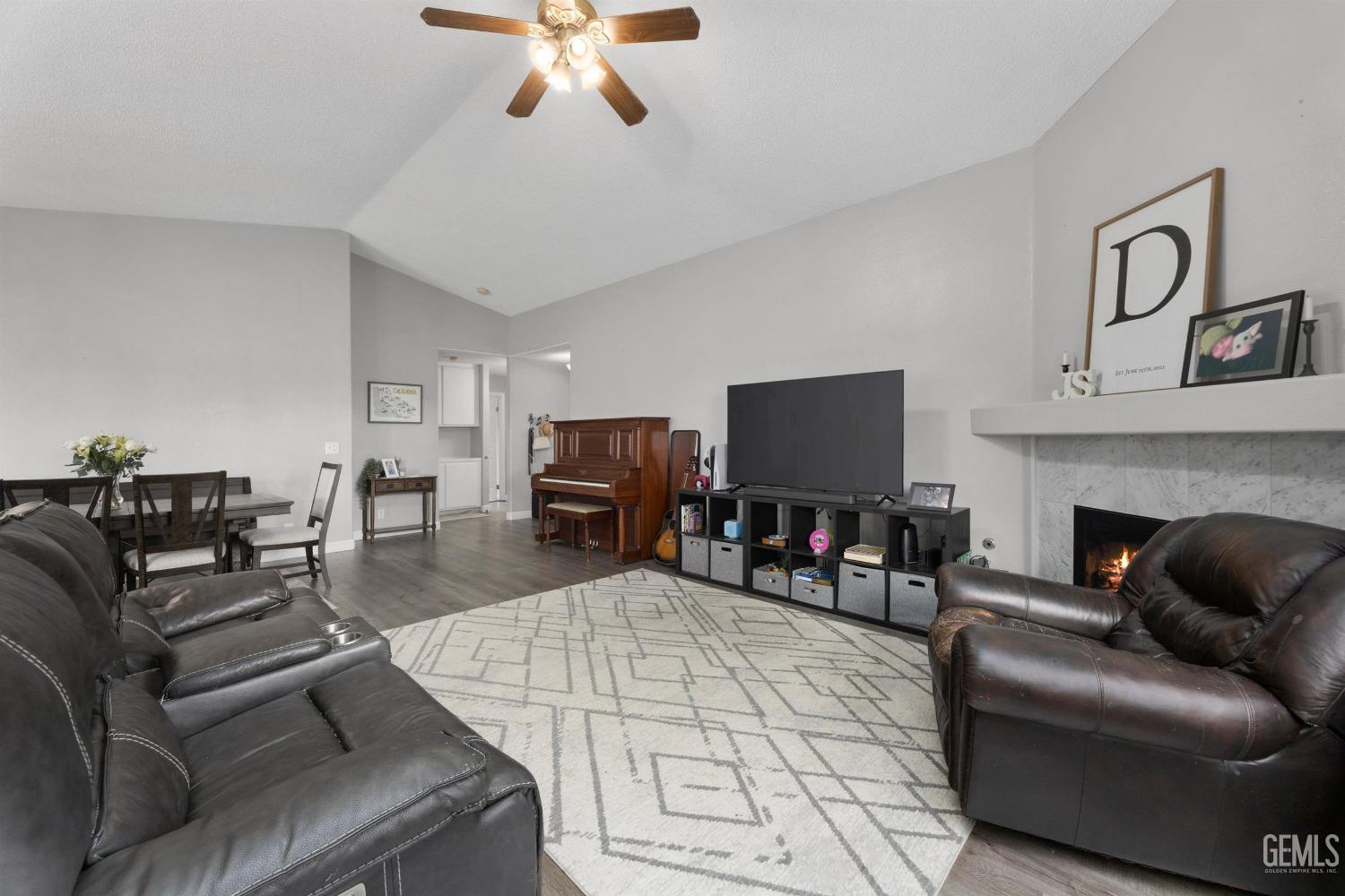 Undisclosed Address Bakersfield, CA 93312 - Photo 9 of 31 a living room with furniture and a flat screen tv