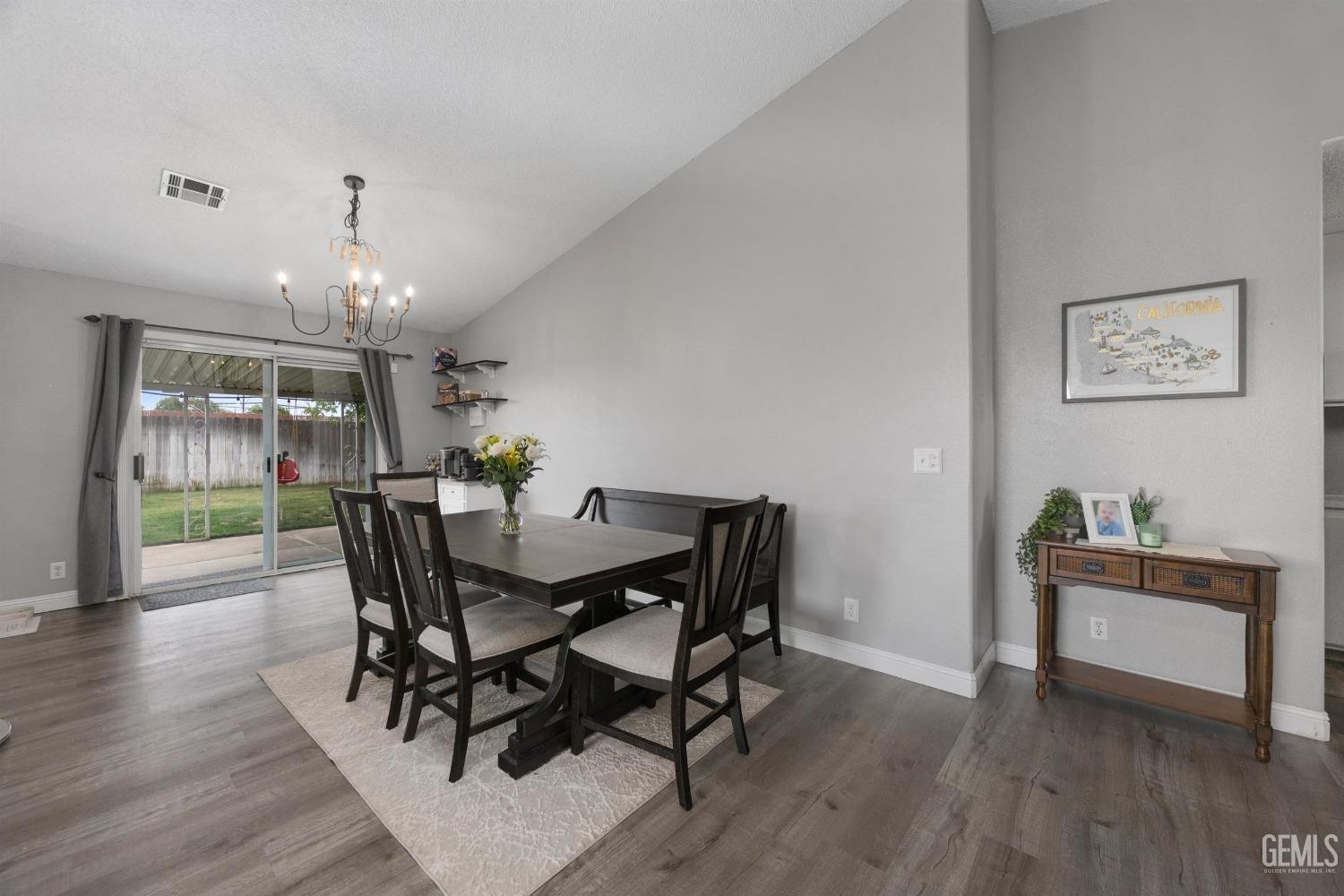 Undisclosed Address Bakersfield, CA 93312 - Photo 10 of 31 a view of a dining room with furniture window and wooden floor