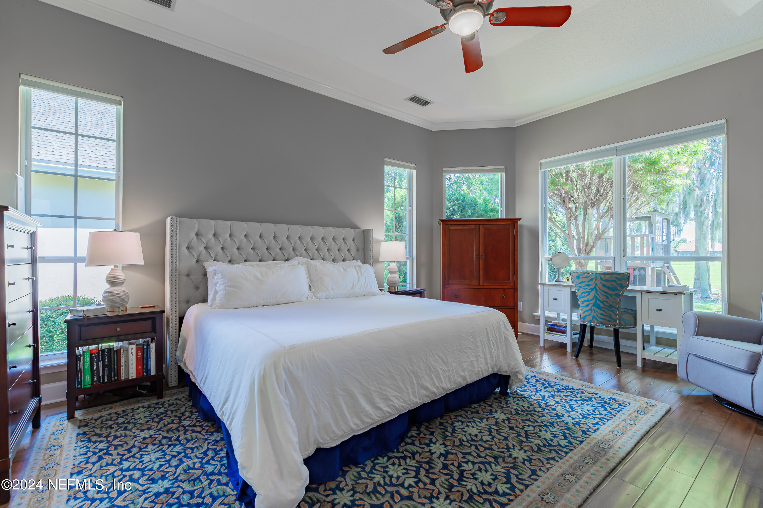 2032 Rivergate Drive Fleming Island, FL 32003 - Photo 14 of 120 a bedroom with a bed a couch and a window