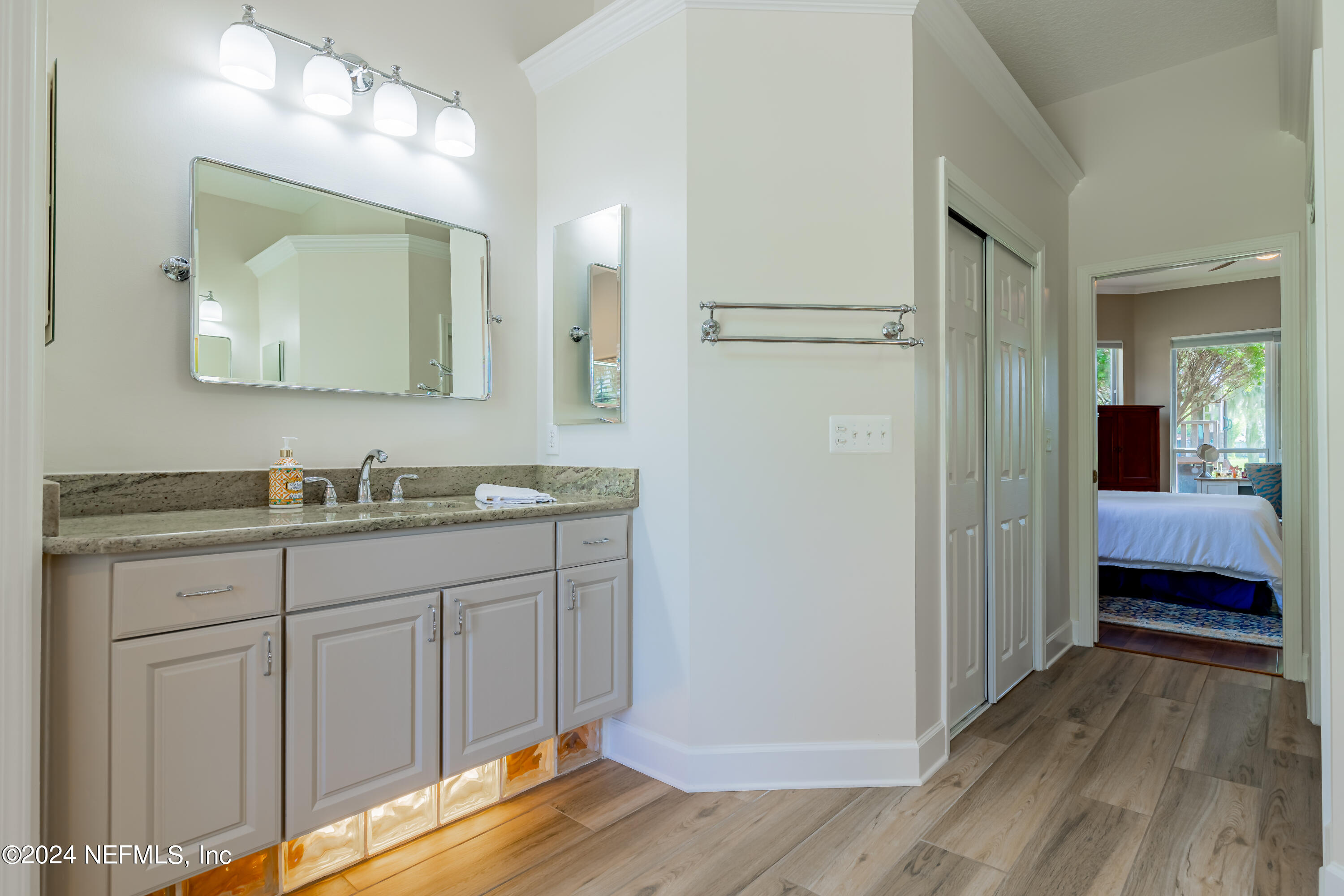 2032 Rivergate Drive Fleming Island, FL 32003 - Photo 22 of 120 a bathroom with a sink and a mirror