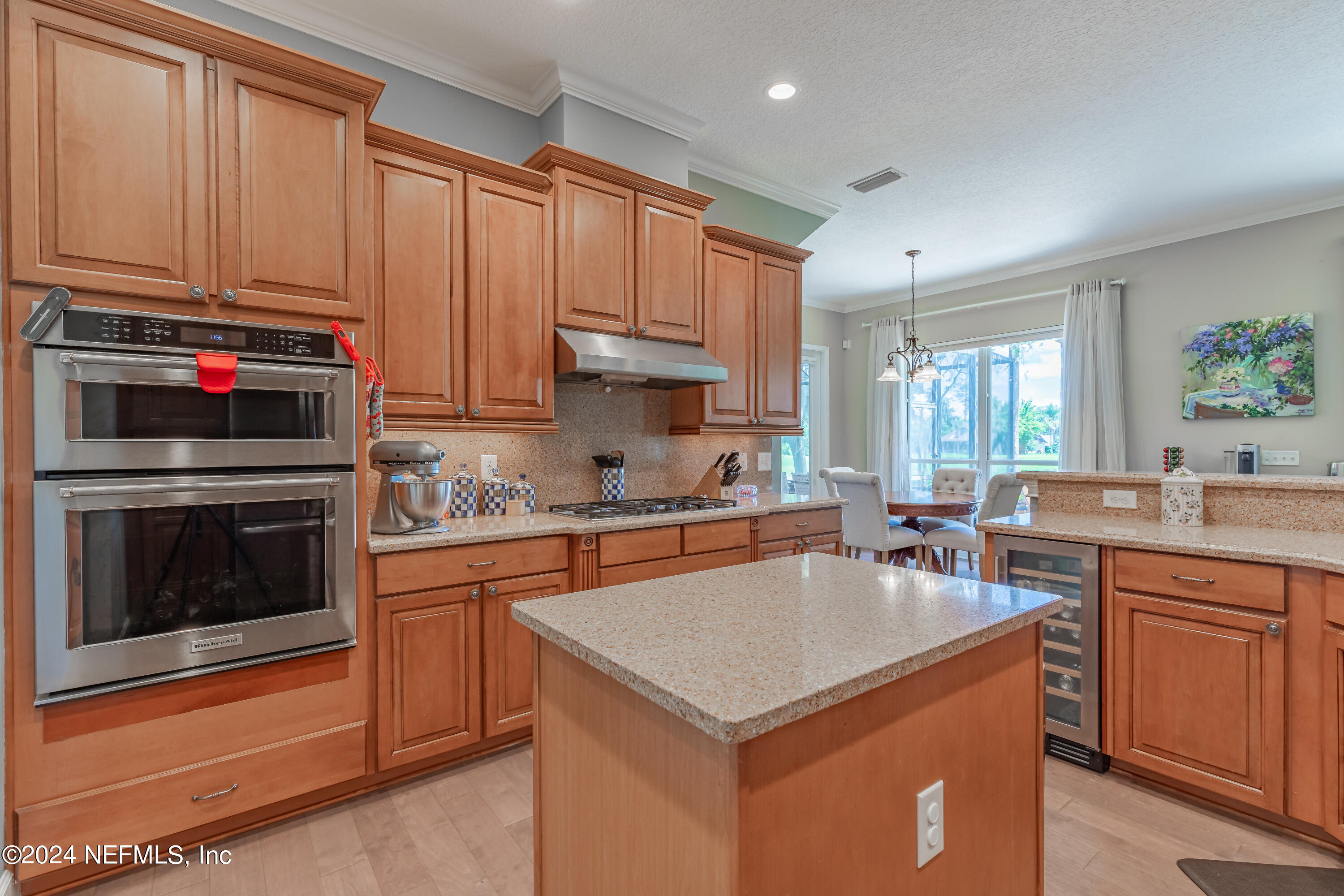 2032 Rivergate Drive Fleming Island, FL 32003 - Photo 23 of 120 a kitchen with granite countertop a sink stove and cabinets
