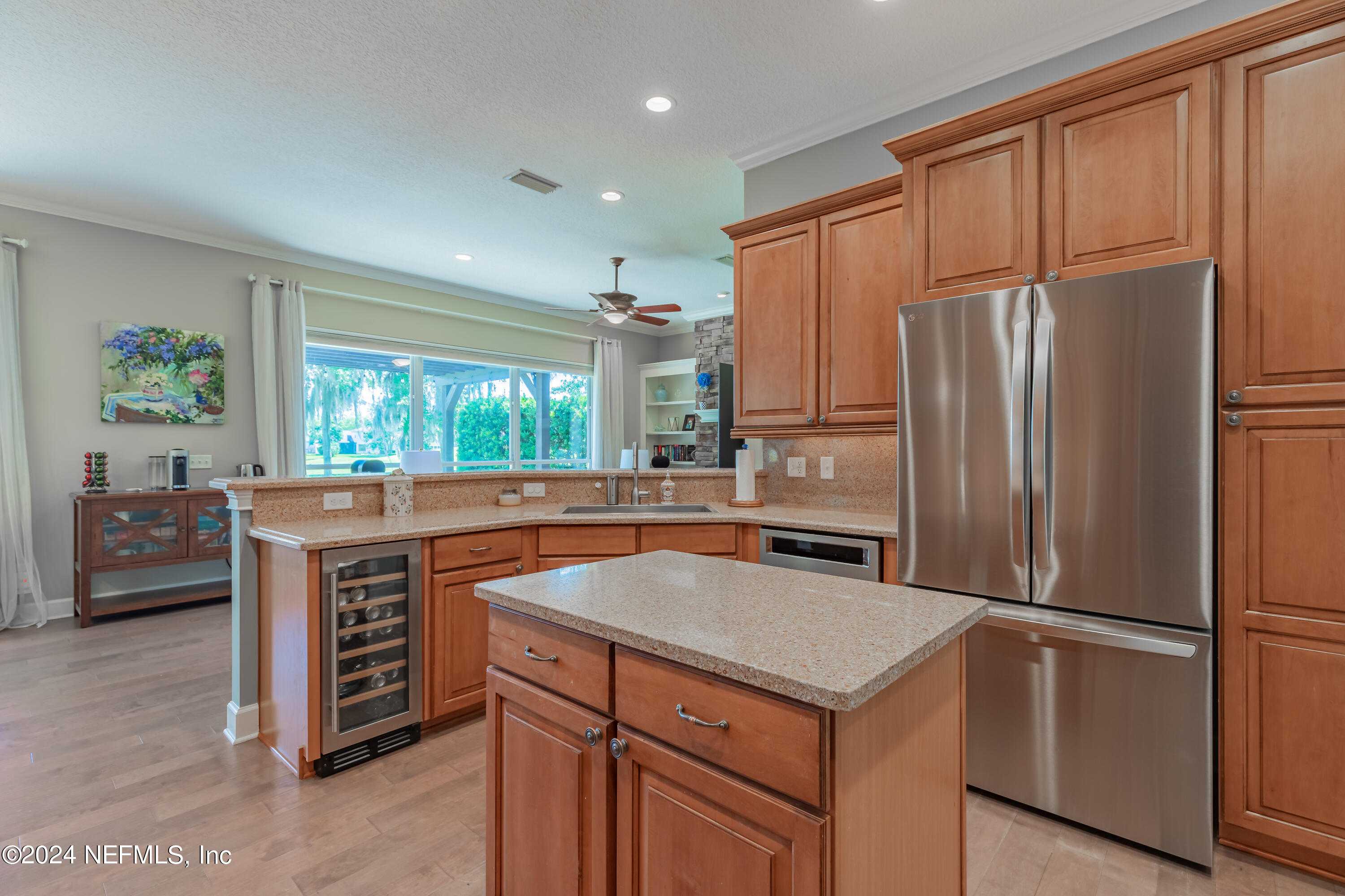 2032 Rivergate Drive Fleming Island, FL 32003 - Photo 26 of 120 a kitchen with stainless steel appliances granite countertop a refrigerator a stove a sink and a refrigerator