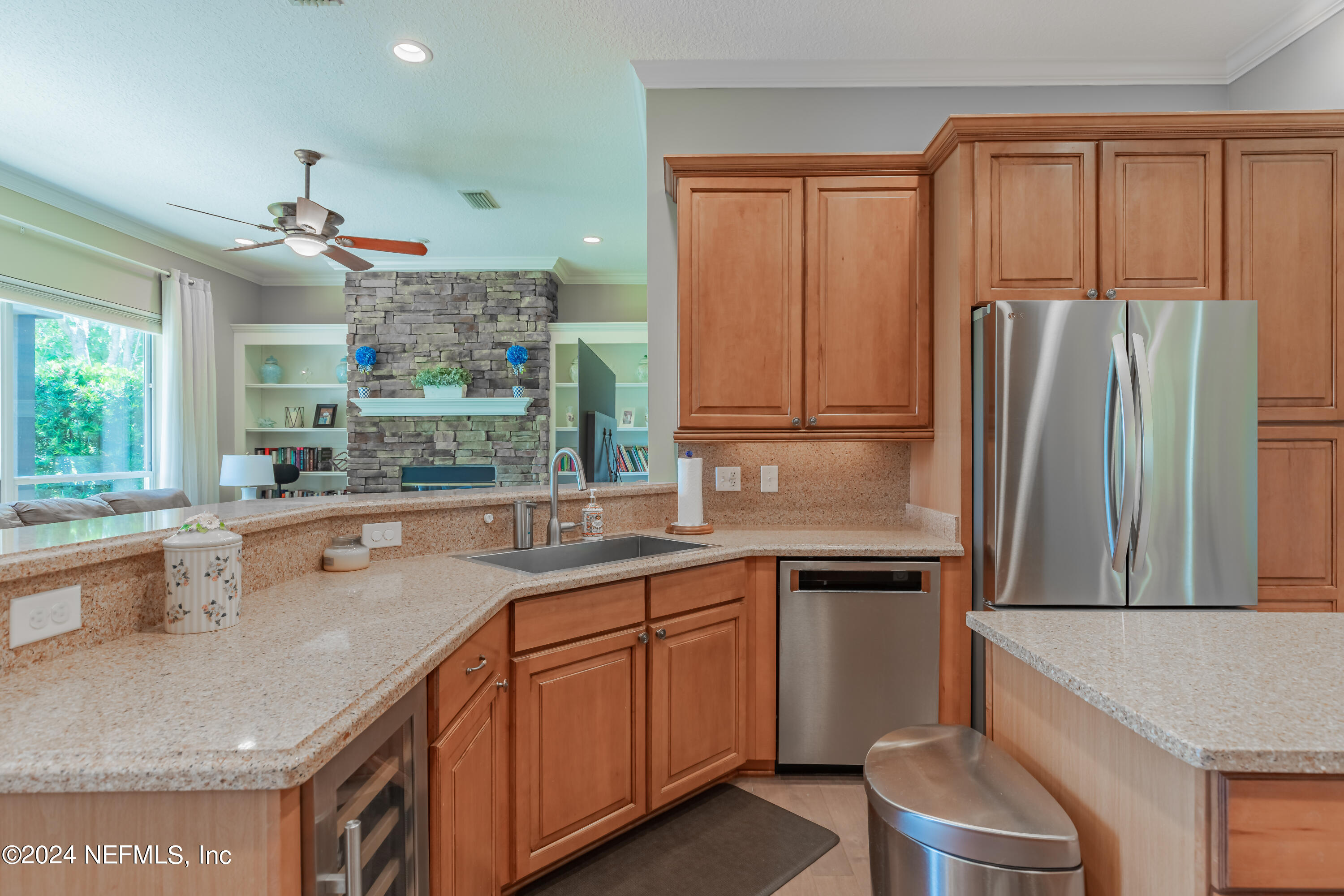 2032 Rivergate Drive Fleming Island, FL 32003 - Photo 28 of 120 a kitchen with a sink refrigerator and microwave