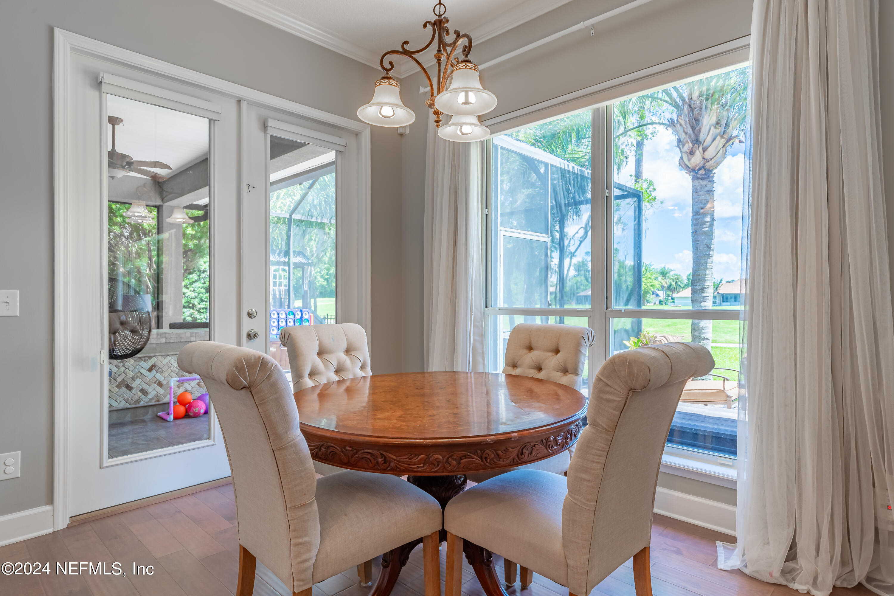 2032 Rivergate Drive Fleming Island, FL 32003 - Photo 29 of 120 a dining room with furniture window and wooden floor