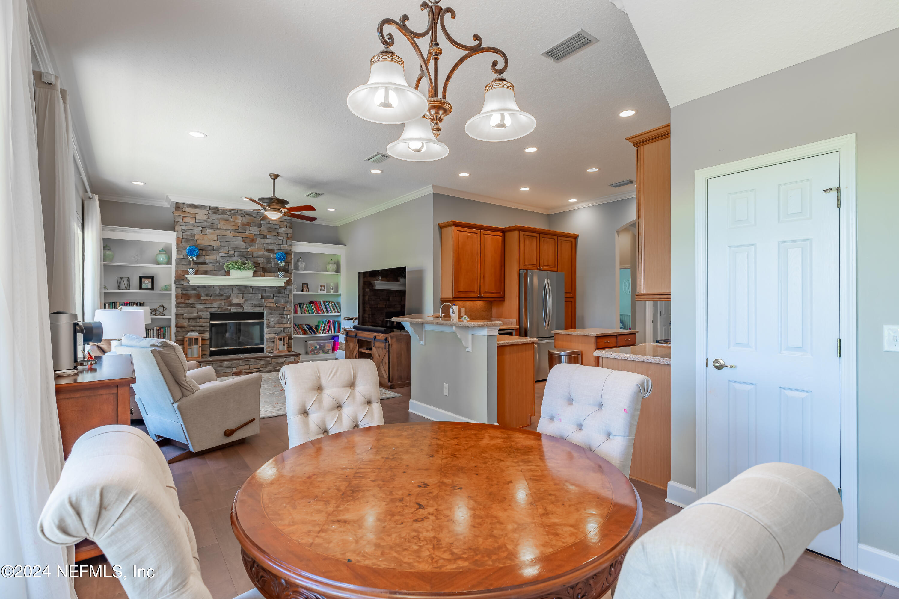 2032 Rivergate Drive Fleming Island, FL 32003 - Photo 31 of 120 a living room with furniture and a chandelier