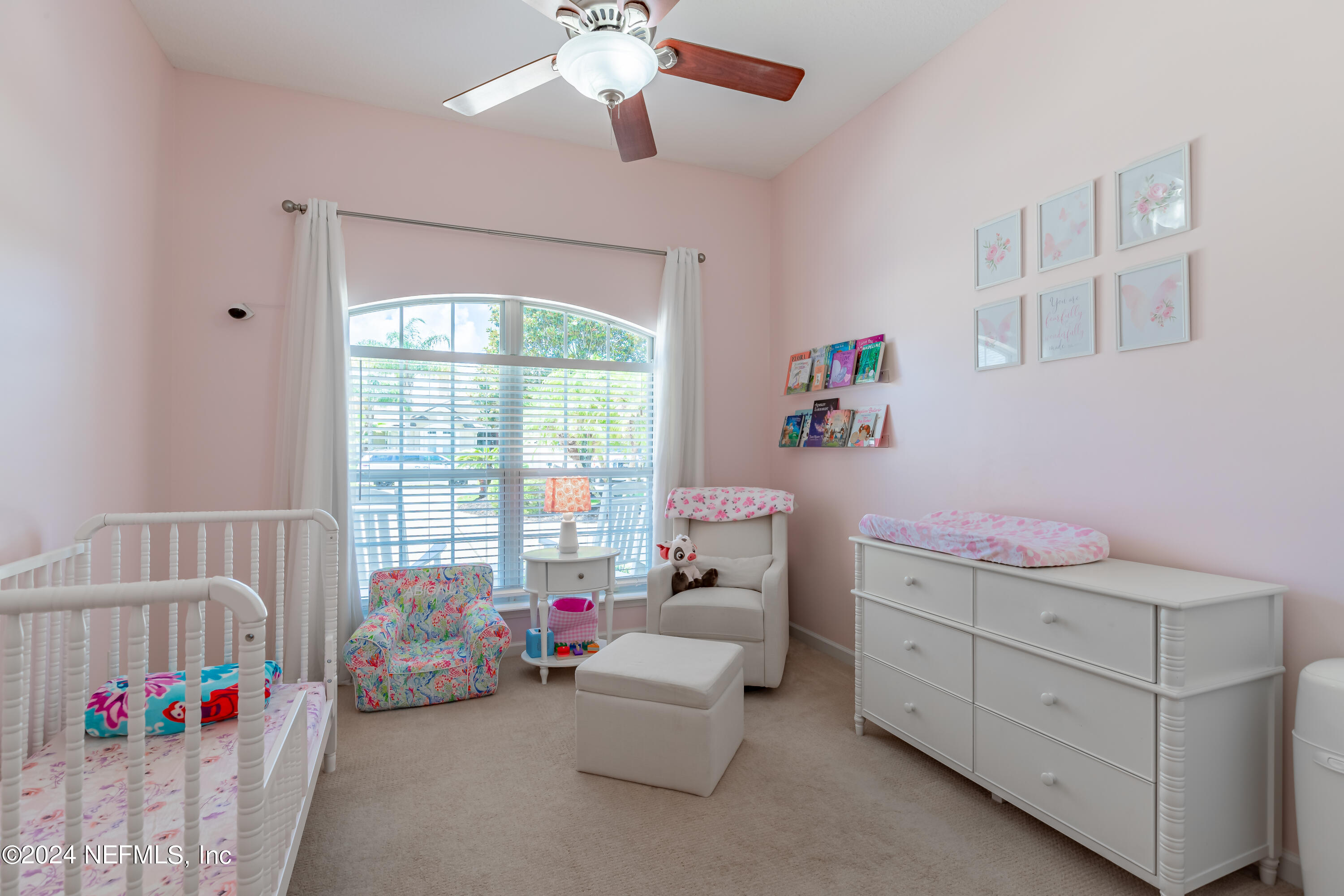 2032 Rivergate Drive Fleming Island, FL 32003 - Photo 37 of 120 a bedroom with furniture and a large window