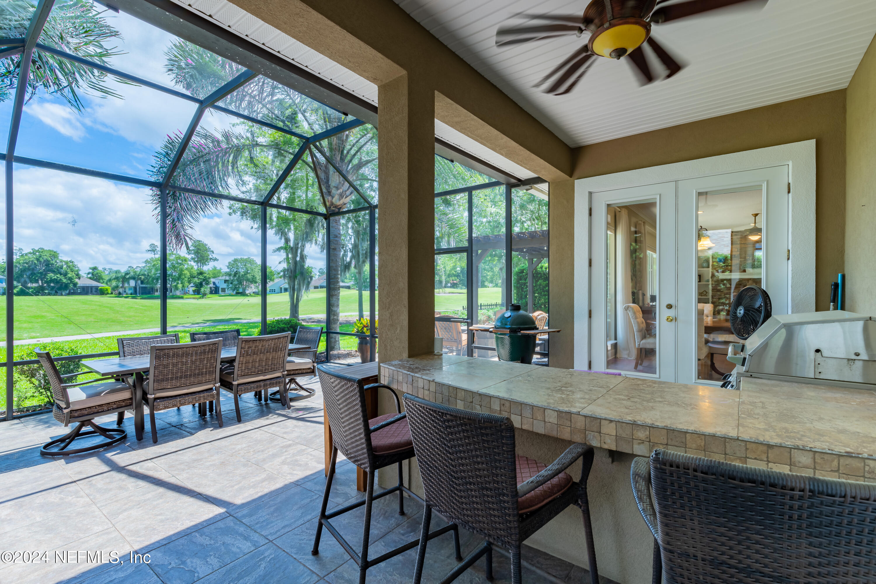 2032 Rivergate Drive Fleming Island, FL 32003 - Photo 46 of 120 a dining room with wooden floor a chandelier a glass table and chairs