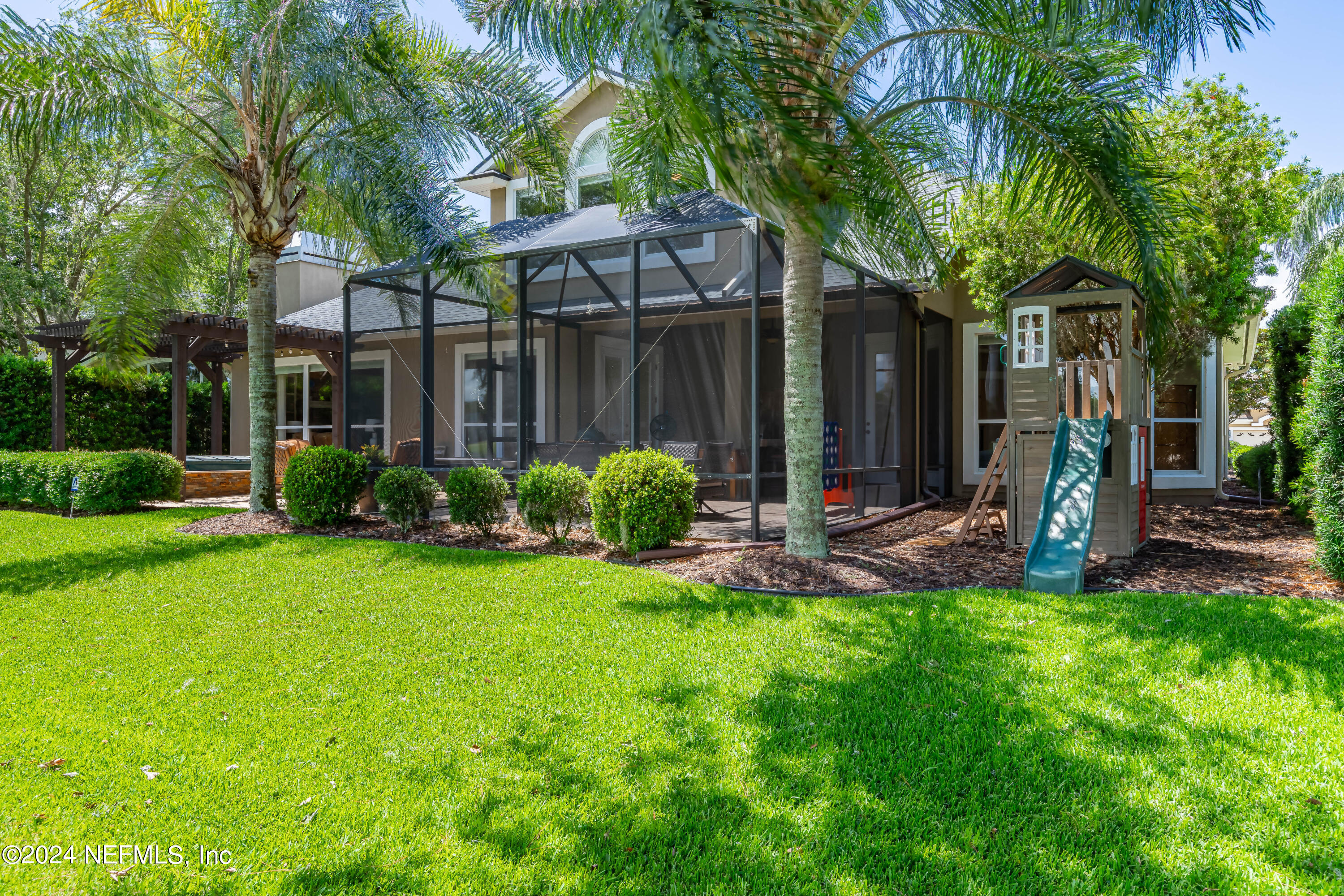 2032 Rivergate Drive Fleming Island, FL 32003 - Photo 51 of 120 a view of a house with a backyard and a tree