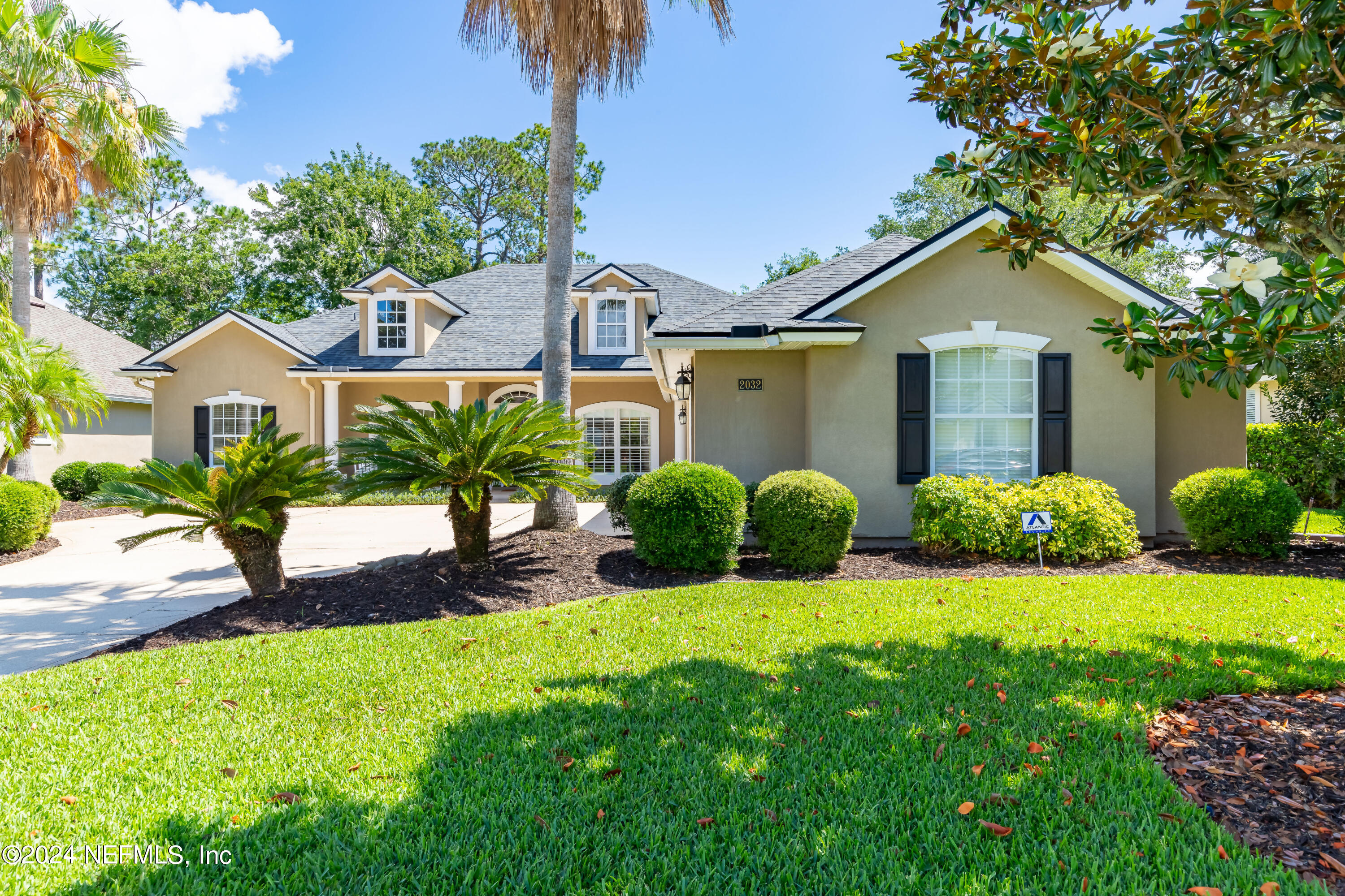 2032 Rivergate Drive Fleming Island, FL 32003 - Photo 58 of 120 a view of a house with a yard and potted plants