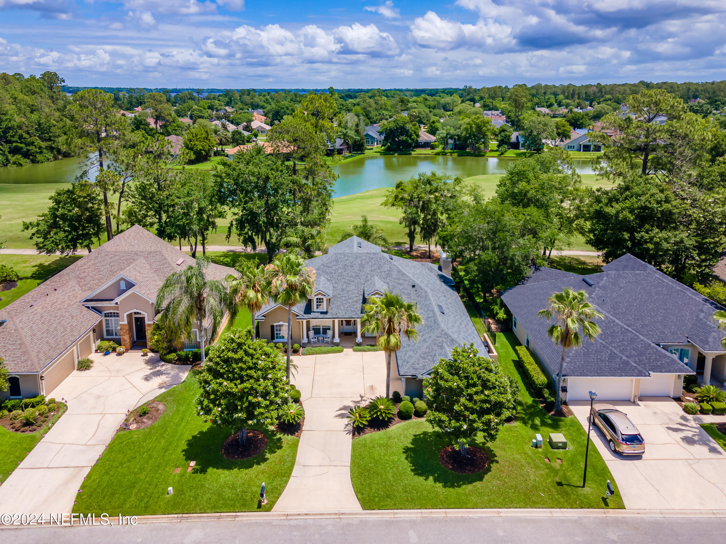 2032 Rivergate Drive Fleming Island, FL 32003 - Photo 60 of 120 an aerial view of a house with a garden and lake view