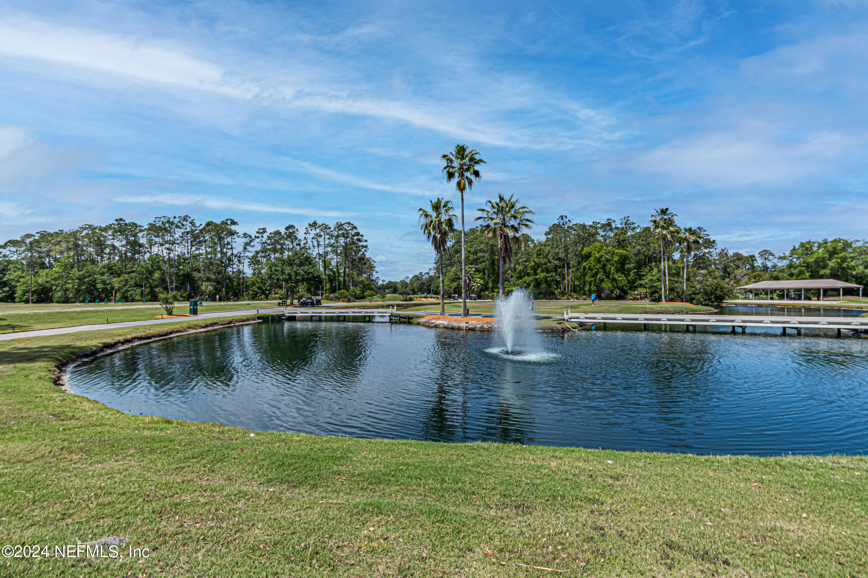 2032 Rivergate Drive Fleming Island, FL 32003 - Photo 79 of 120 a view of a lake with a mountain in the background
