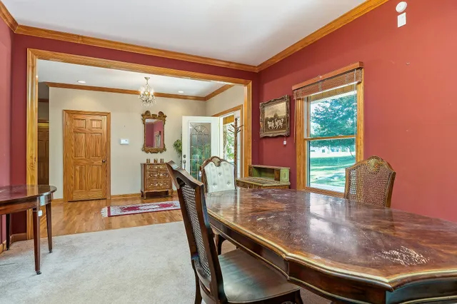 a kitchen that has stainless steel appliances granite countertop a sink a stove and a refrigerator