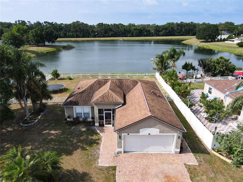 a aerial view of a house with a lake view