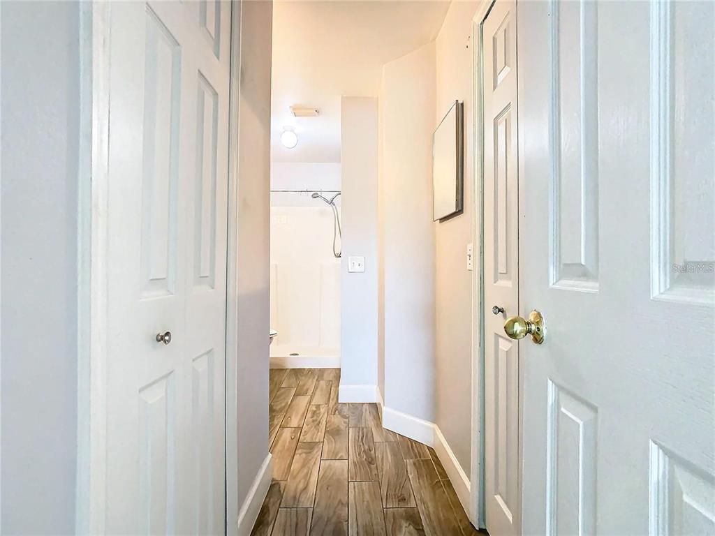 3194 Windmill Point Boulevard Kissimmee, FL 34746 - Photo 17 of 32 a view of a hallway with wooden floor and staircase