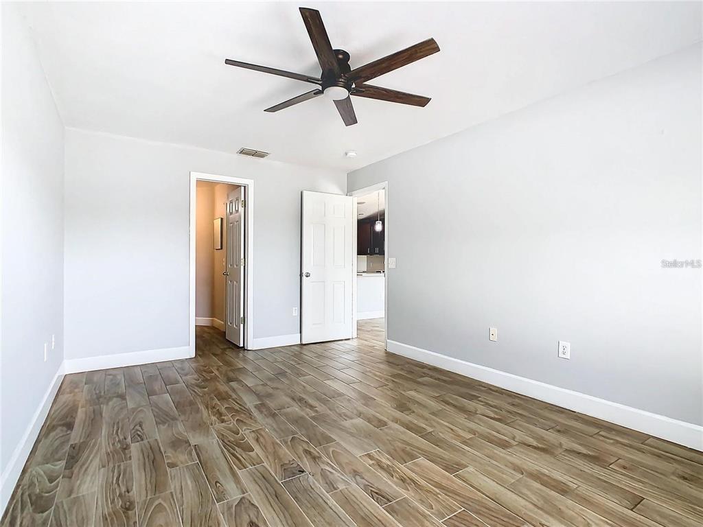 3194 Windmill Point Boulevard Kissimmee, FL 34746 - Photo 20 of 32 a view of empty room with wooden floor