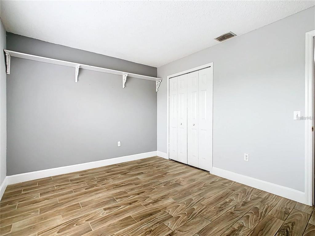 3194 Windmill Point Boulevard Kissimmee, FL 34746 - Photo 24 of 32 a view of a room with wooden floor