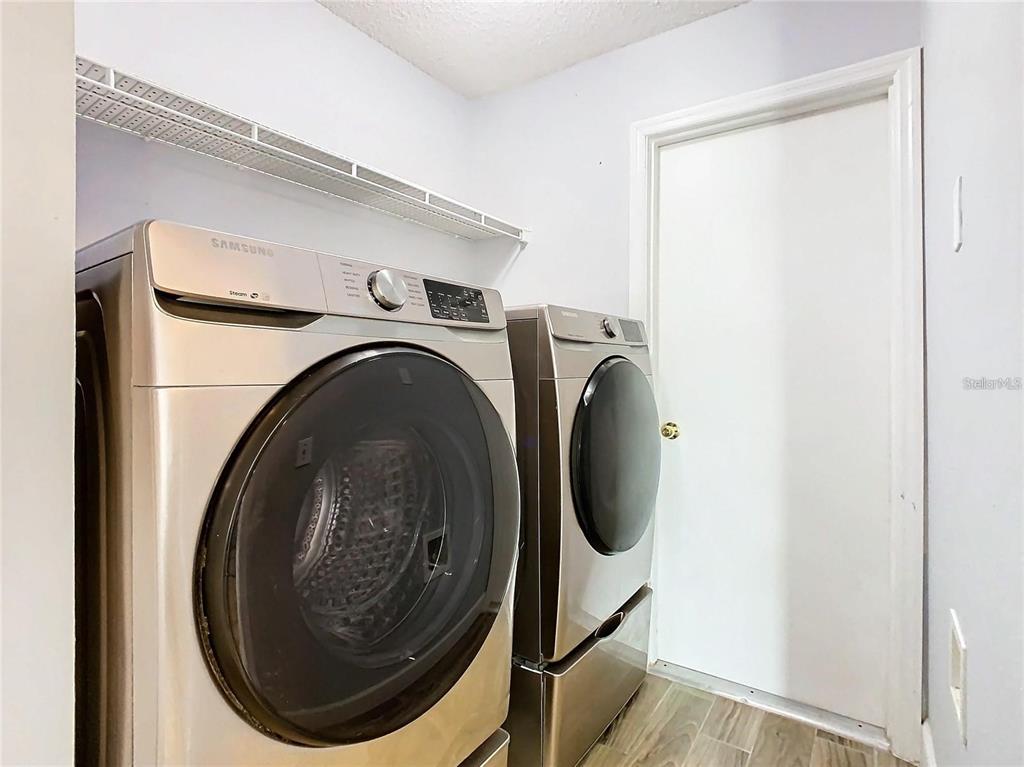 3194 Windmill Point Boulevard Kissimmee, FL 34746 - Photo 25 of 32 a utility room with dryer and washer