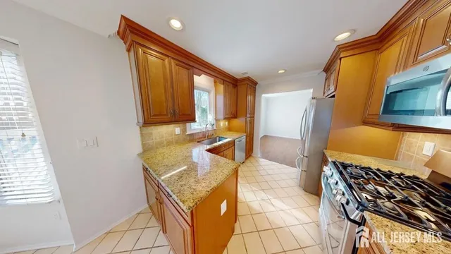 a bathroom with a tub toilet and sink