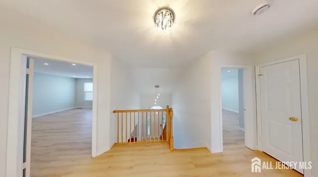 a view of a hallway view with staircase