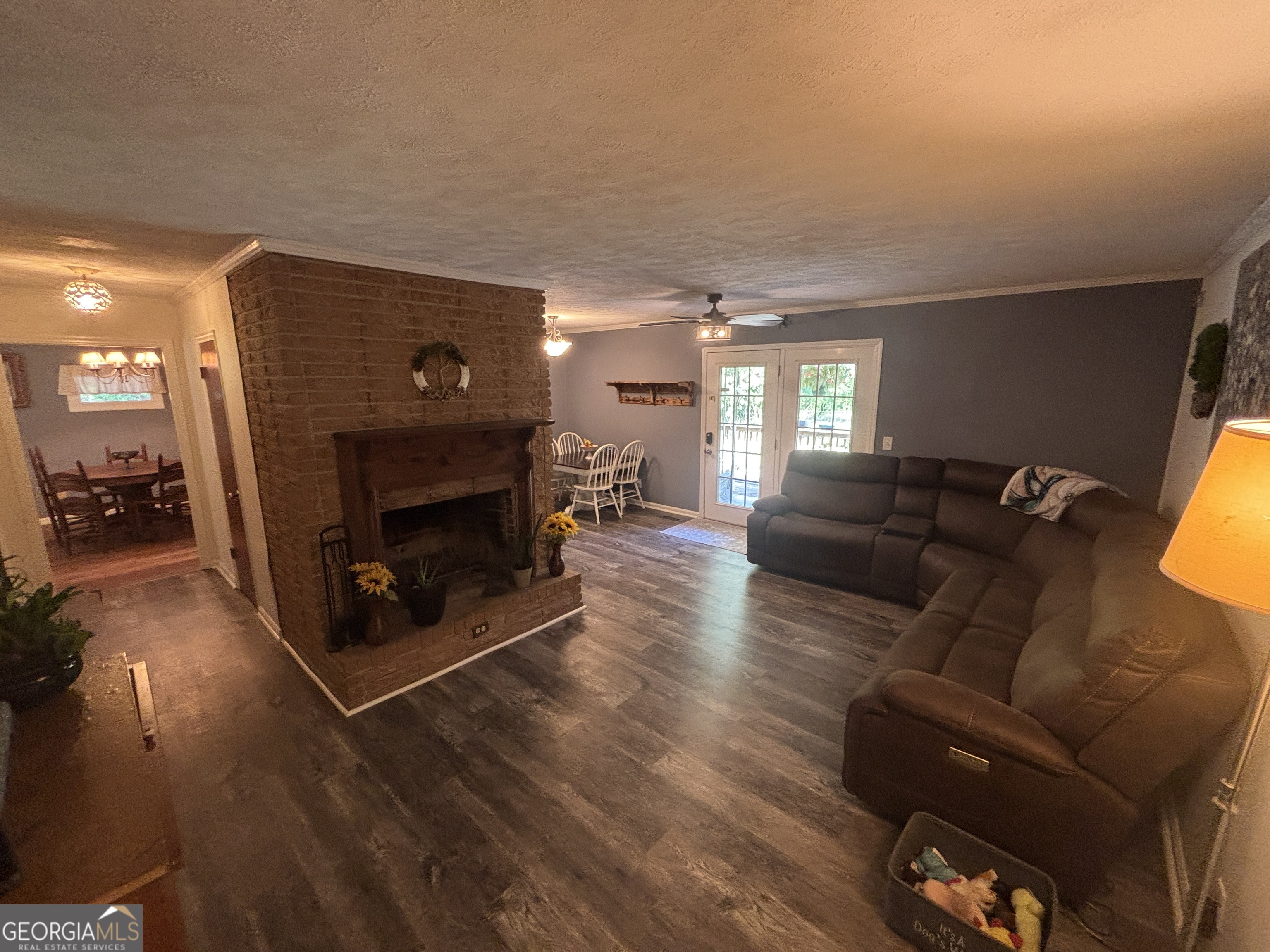 152 Crest Drive Cochran, GA 31014 - Photo 13 of 54 a living room with furniture and a fireplace