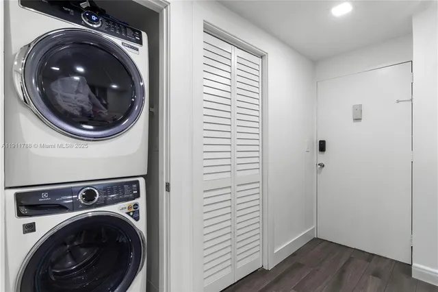 a view of a hallway with washer and dryer