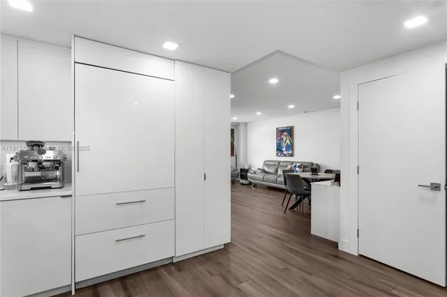 a view of a living room and hardwood floor
