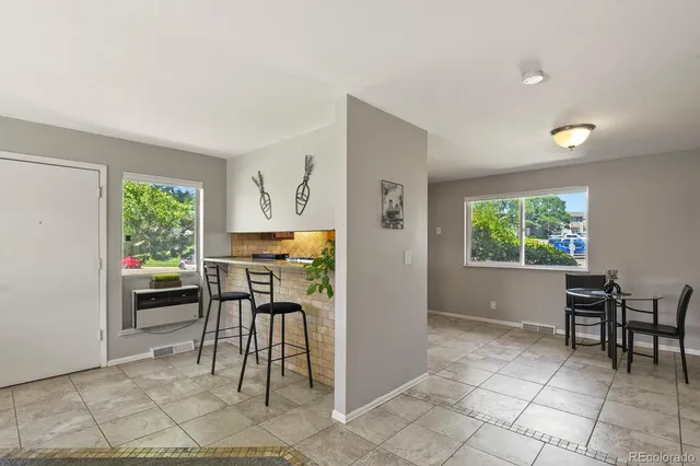 a view of work space with furniture and window