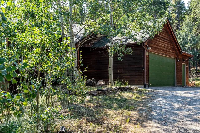 a view of a house with a tree