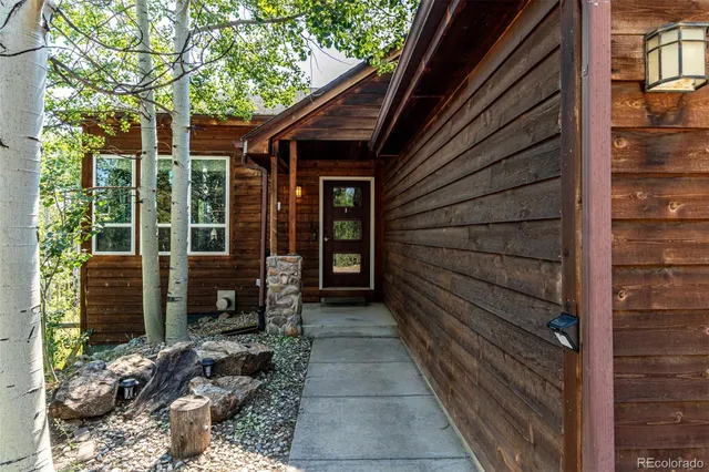 a view of house with door and wooden floor
