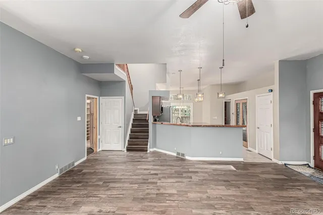 a view of a living room and kitchen