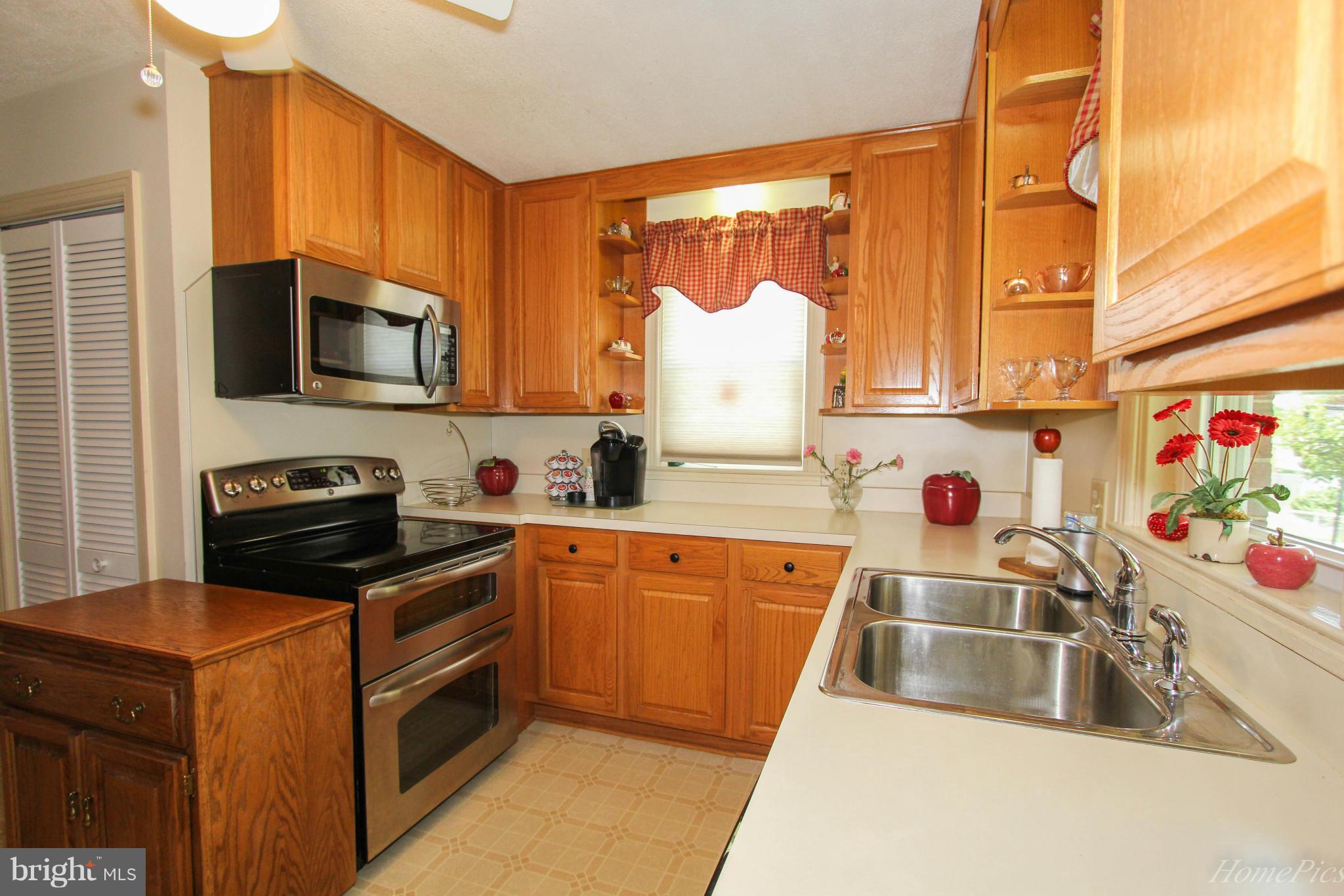 340 Devonshire Road Hagerstown, MD 21740 - Photo 11 of 26 a kitchen with stainless steel appliances a stove a sink a microwave and cabinets