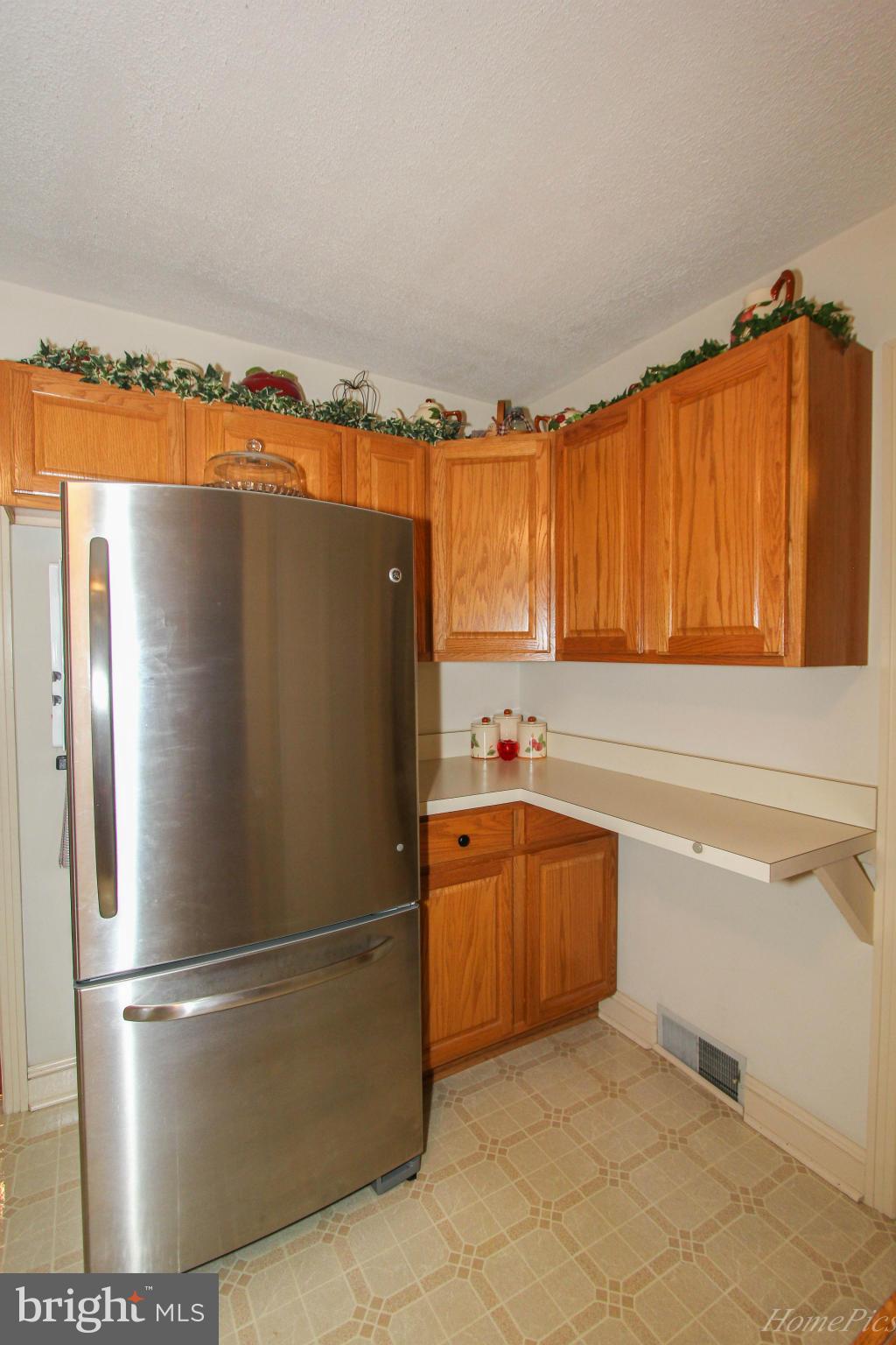 340 Devonshire Road Hagerstown, MD 21740 - Photo 13 of 26 a kitchen with stainless steel appliances granite countertop a refrigerator and a sink