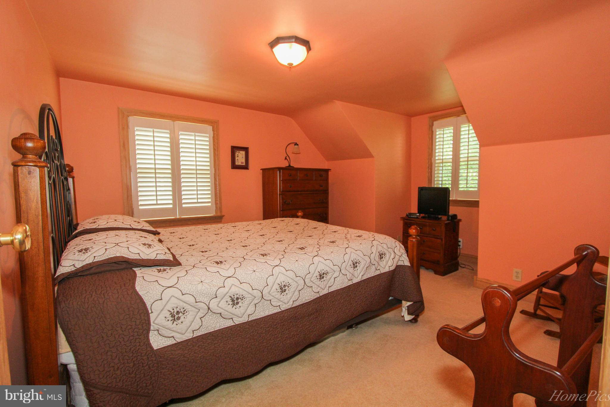 340 Devonshire Road Hagerstown, MD 21740 - Photo 14 of 26 a bed sitting in a bedroom next to a window