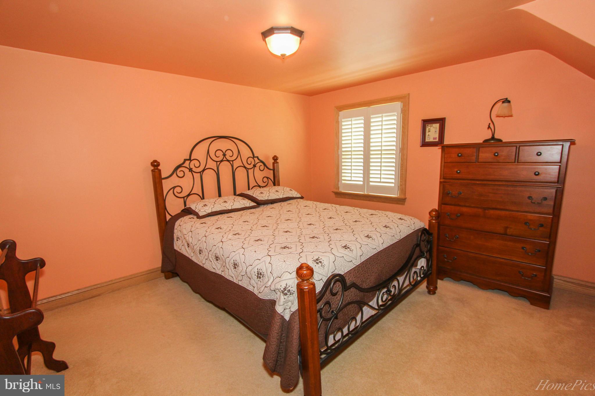340 Devonshire Road Hagerstown, MD 21740 - Photo 15 of 26 a bed sitting in a bedroom next to a window