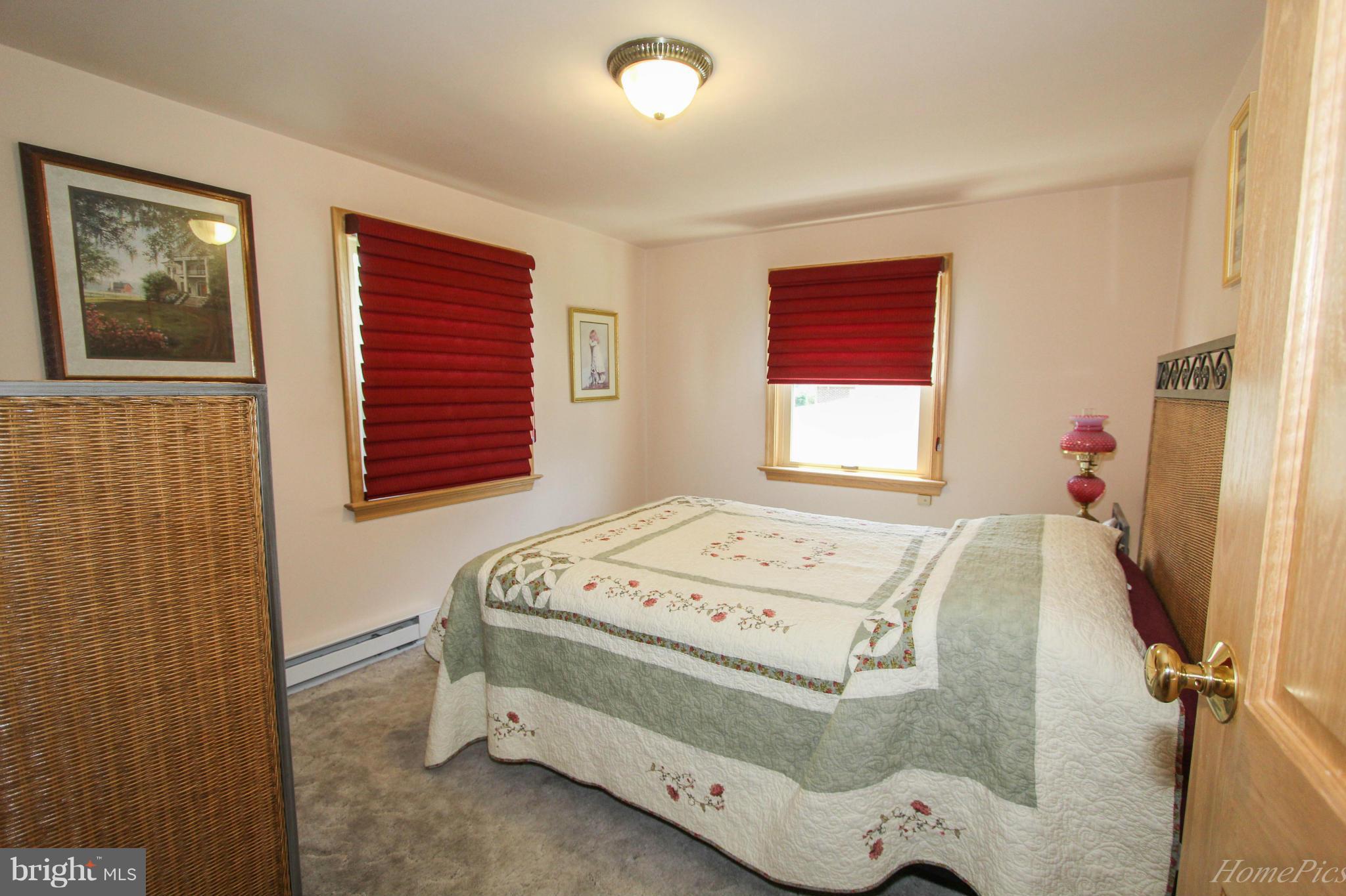 340 Devonshire Road Hagerstown, MD 21740 - Photo 18 of 26 a bedroom with a bed and a window
