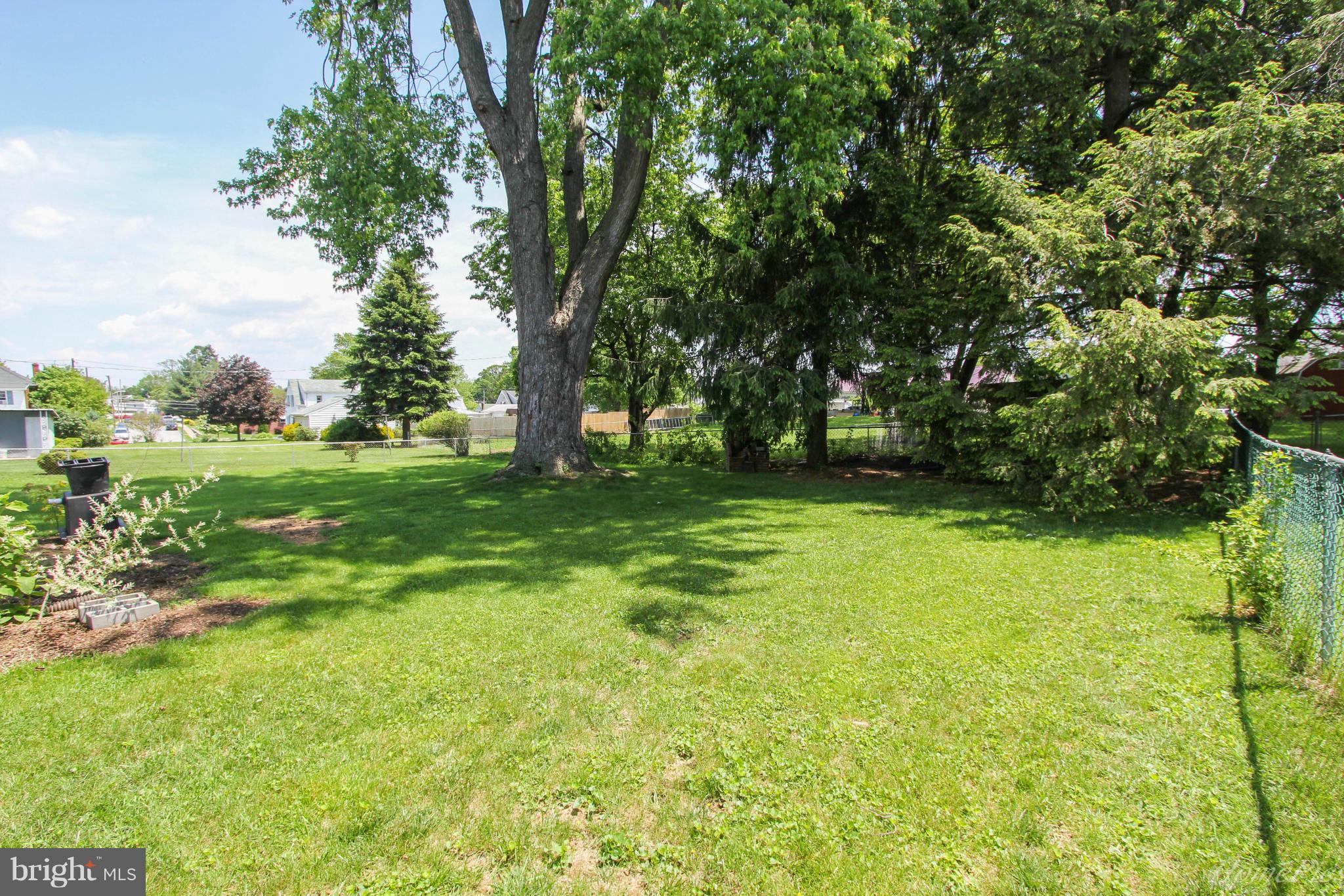 340 Devonshire Road Hagerstown, MD 21740 - Photo 23 of 26 a view of a grassy field with trees