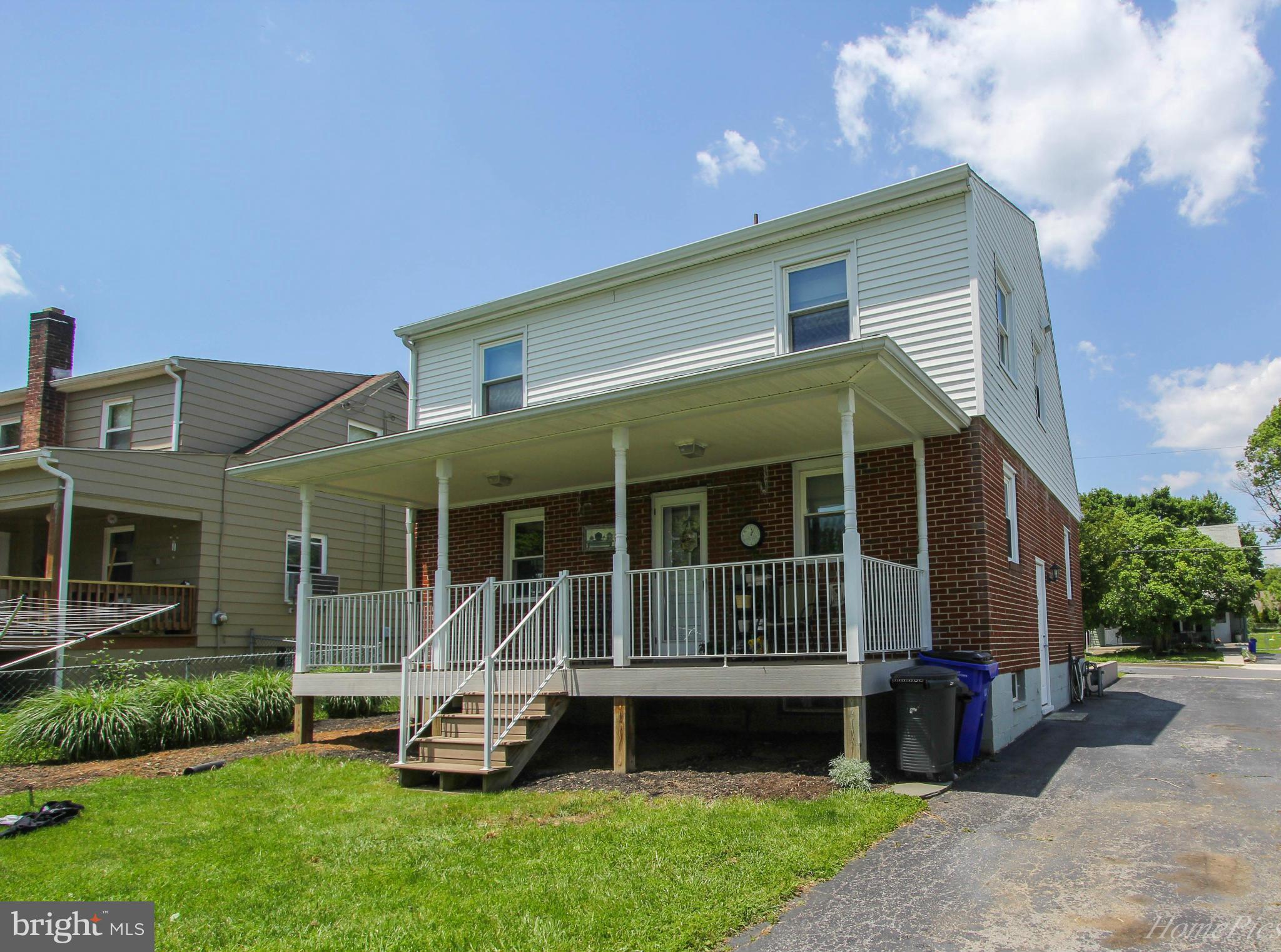 340 Devonshire Road Hagerstown, MD 21740 - Photo 25 of 26 a front view of a house with a garden and porch